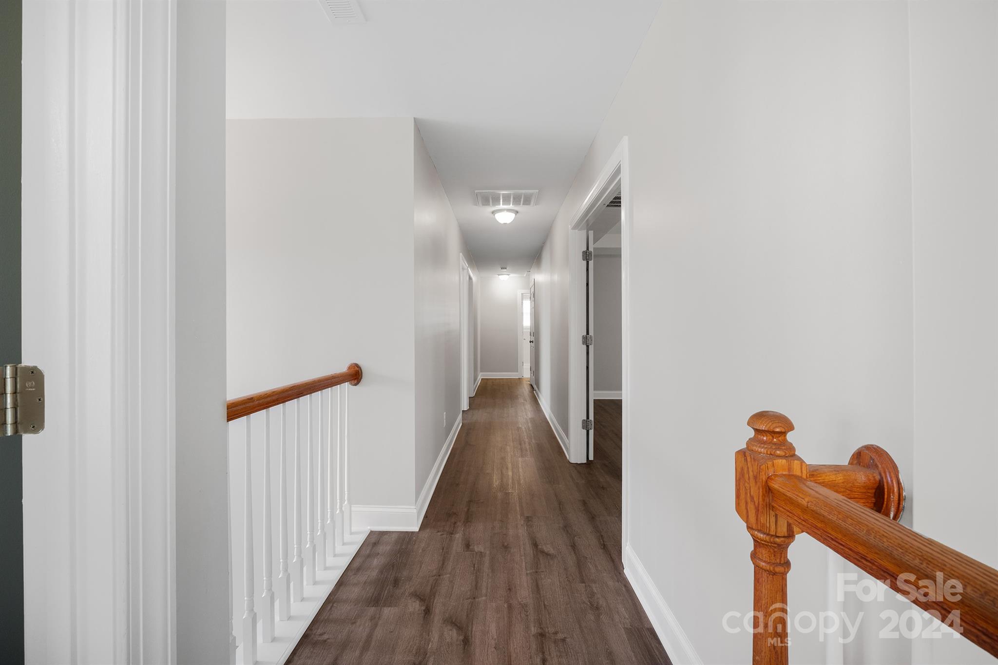 4009 Thorndale Road Indian Trail, NC 28079 - Photo 24 of 48 a view of a hallway with wooden floor and staircase