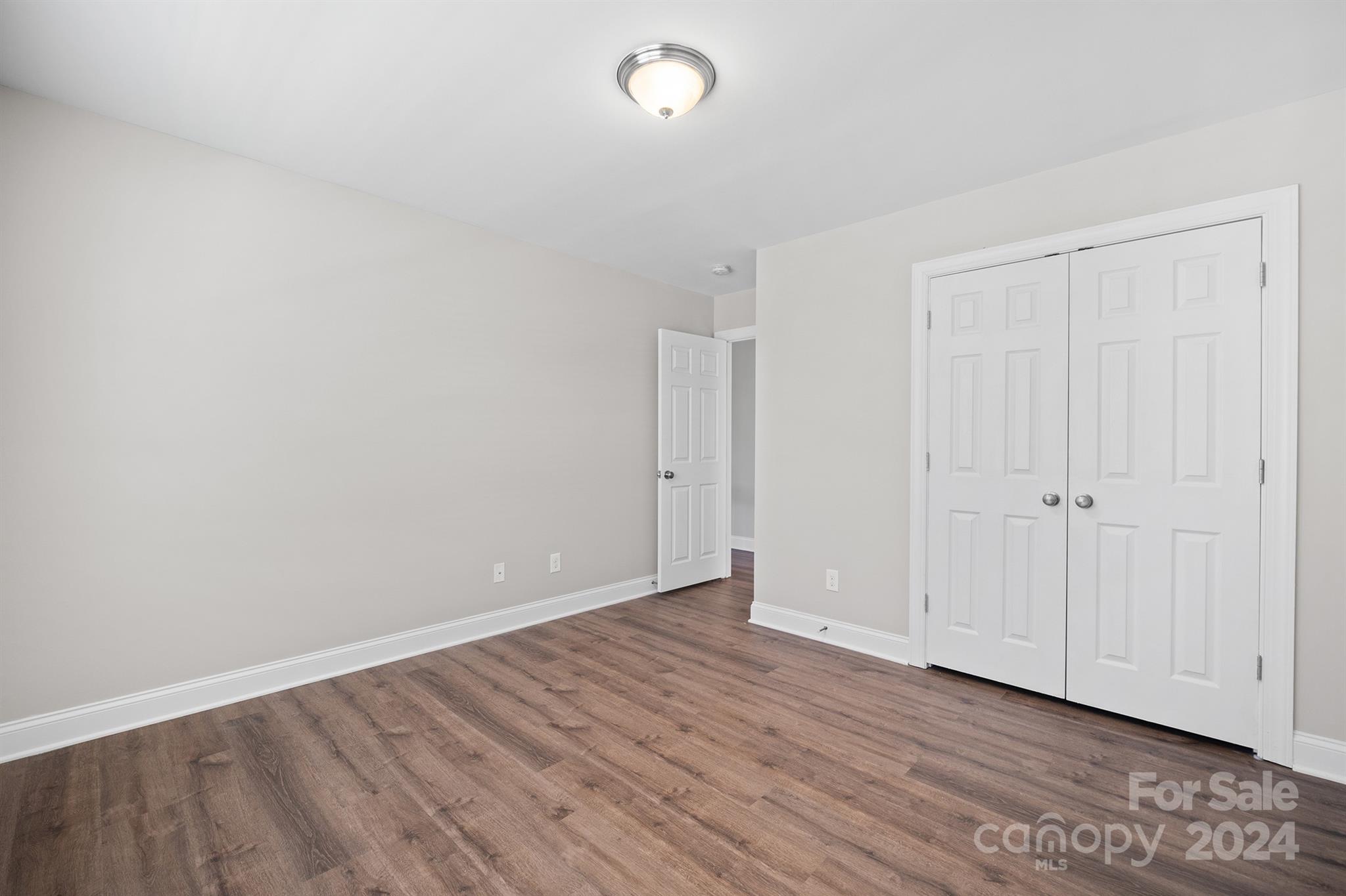 4009 Thorndale Road Indian Trail, NC 28079 - Photo 26 of 48 a view of an empty room with wooden floor