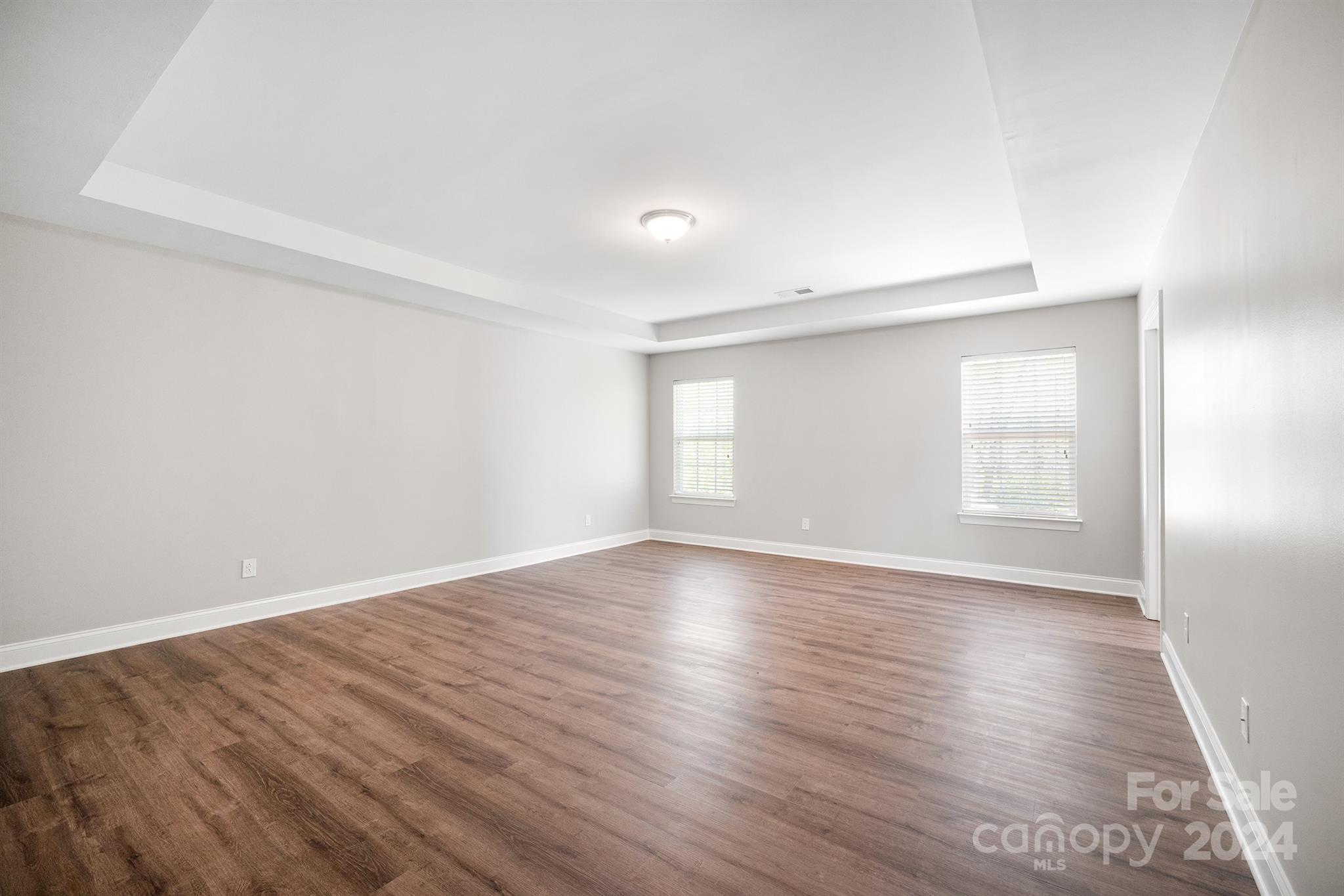 4009 Thorndale Road Indian Trail, NC 28079 - Photo 27 of 48 a view of an empty room with wooden floor and a window