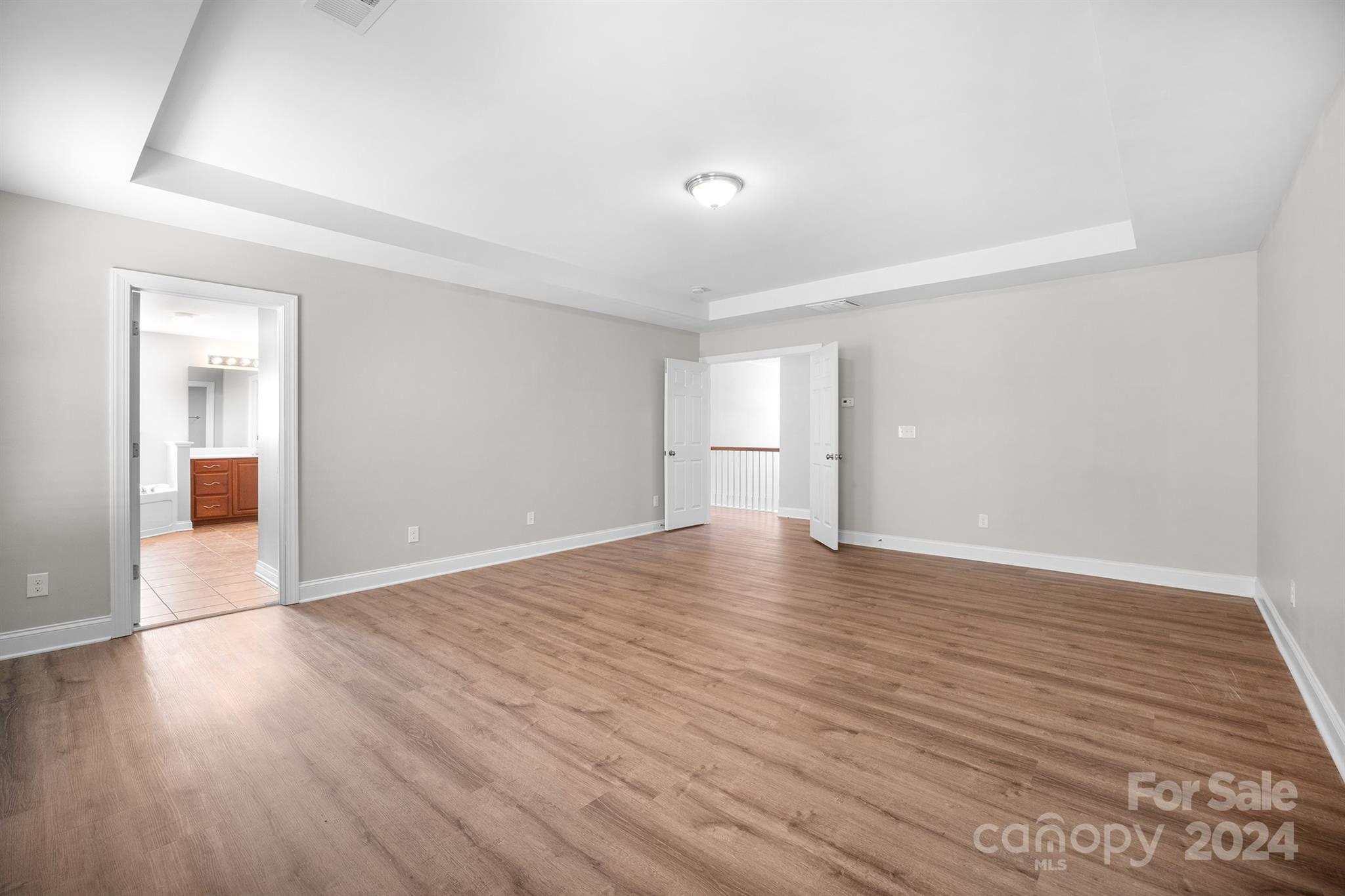 4009 Thorndale Road Indian Trail, NC 28079 - Photo 29 of 48 a view of empty room with wooden floor and entryway