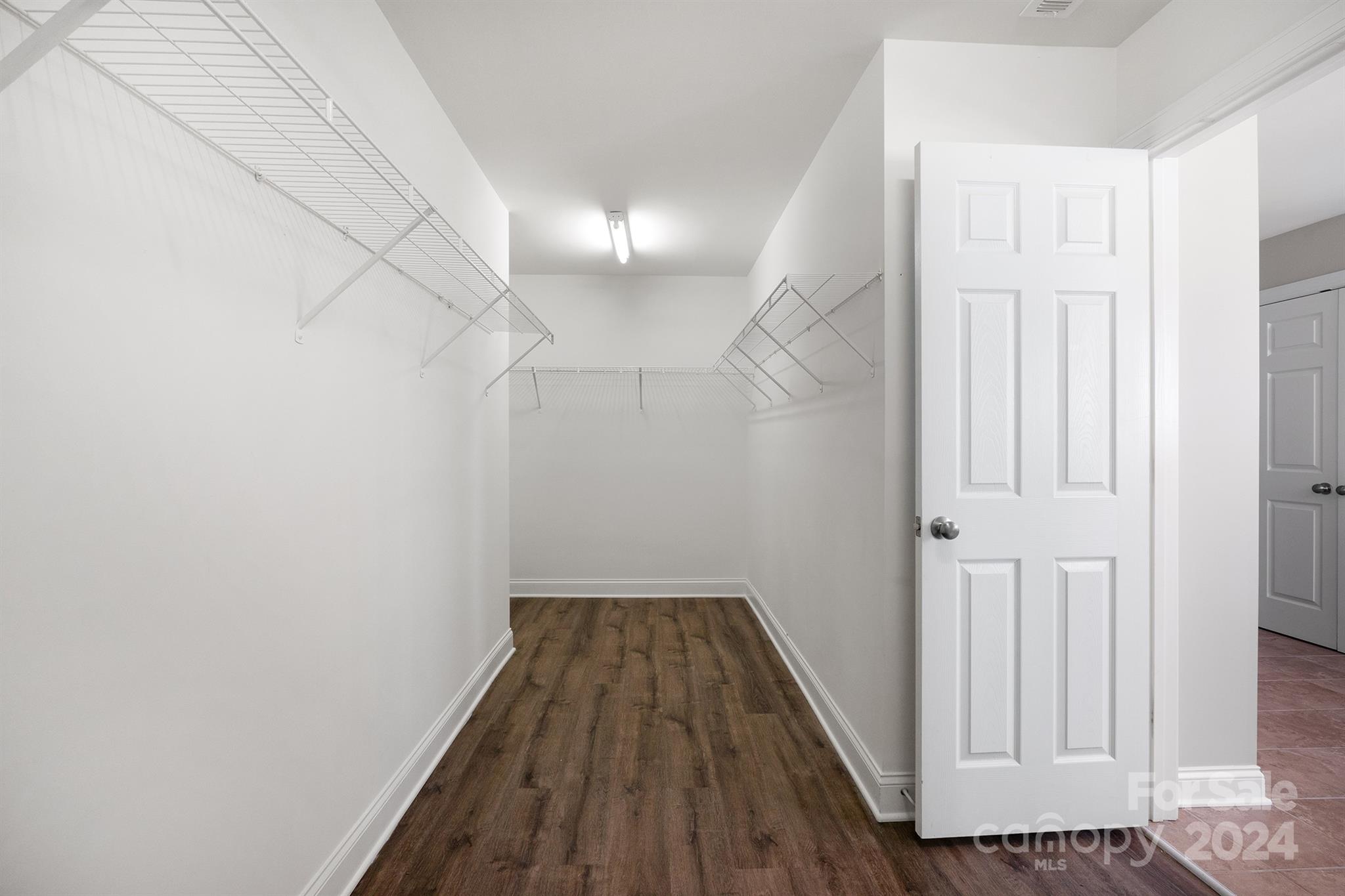 4009 Thorndale Road Indian Trail, NC 28079 - Photo 32 of 48 a view of a hallway with wooden floor