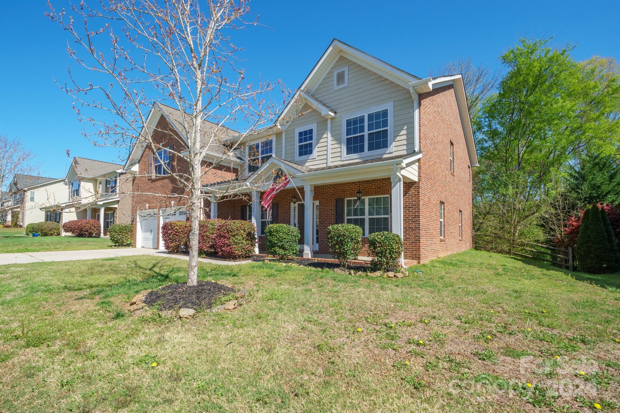 4009 Thorndale Road Indian Trail, NC 28079 - Photo 47 of 48 a view of a big yard in front of a brick house with a large windows