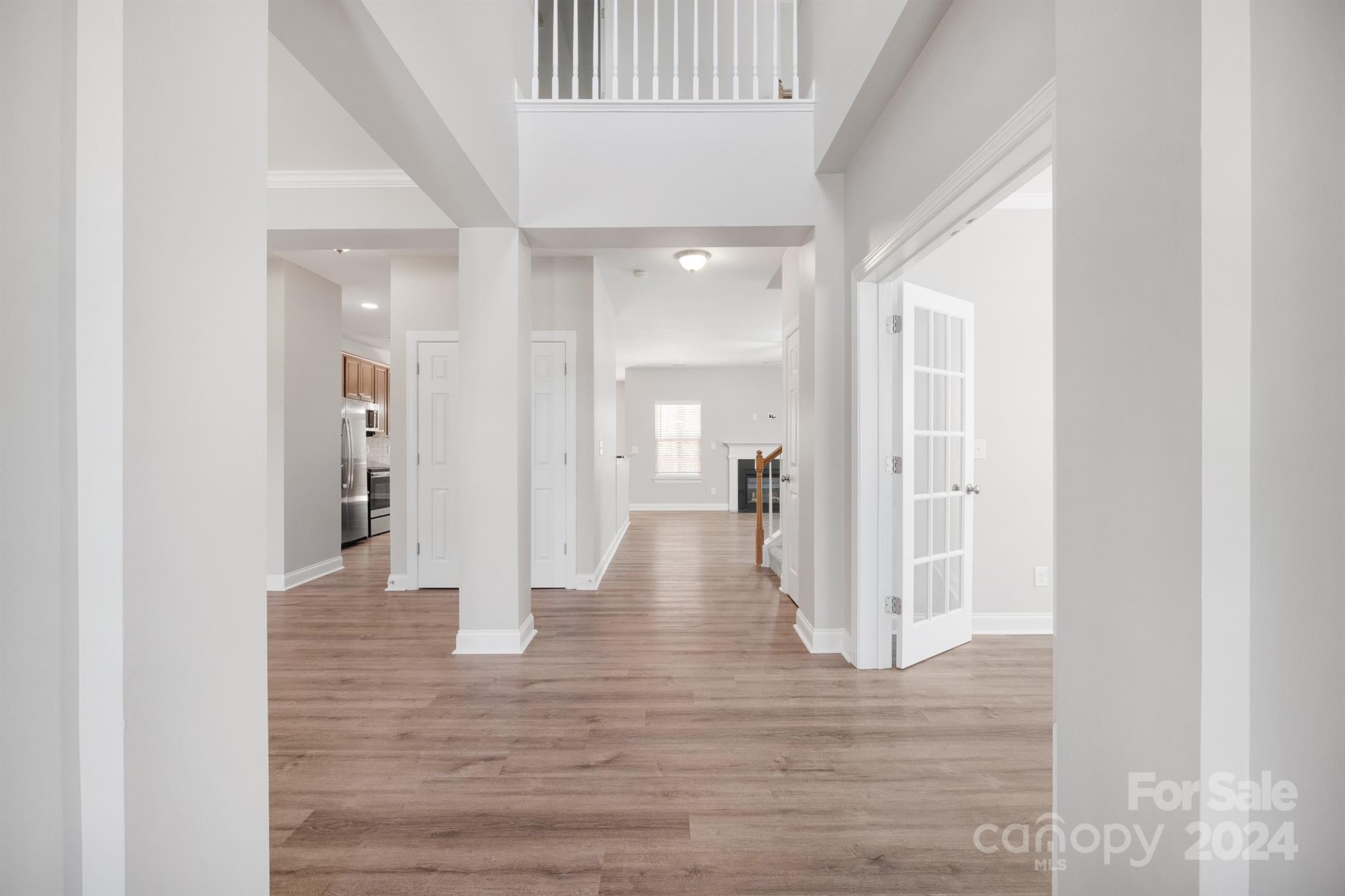 4009 Thorndale Road Indian Trail, NC 28079 - Photo 7 of 48 a view of a hallway with wooden floor