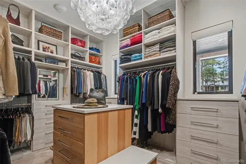 a view of a room with gym equipment and floor to ceiling window