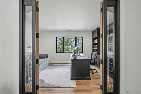 a bedroom with a large bed and a large window
