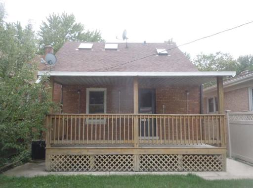 5303 North Rutherford Avenue Chicago, IL 60656 - Photo 16 of 16 a view of a house with a deck