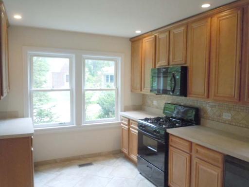 5303 North Rutherford Avenue Chicago, IL 60656 - Photo 4 of 16 a kitchen with a window a sink and a counter top space