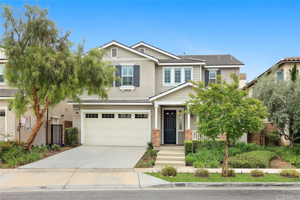 9869 La Vine Court Rancho Cucamonga, CA 91701 - Photo 1 of 1 a front view of a house with a garden and garage