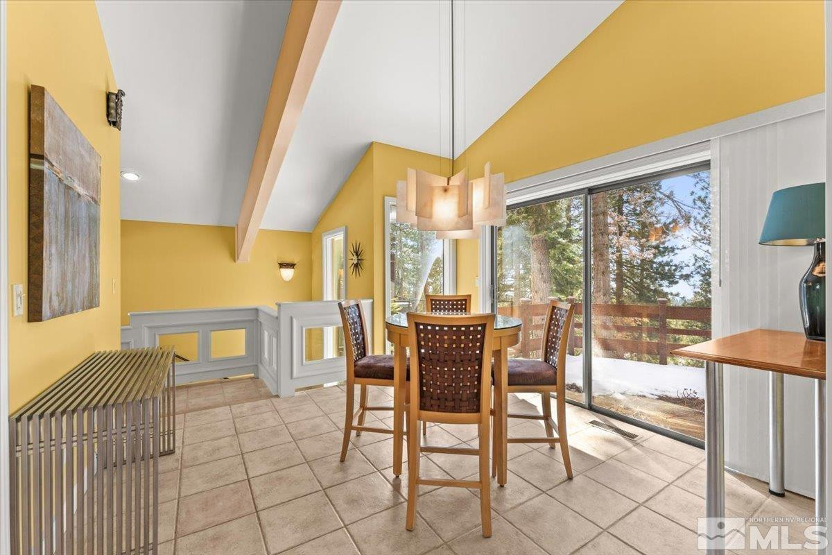 449 Fairview Boulevard Incline Village, NV 89451 - Photo 18 of 40 a dining room with furniture and a floor to ceiling window