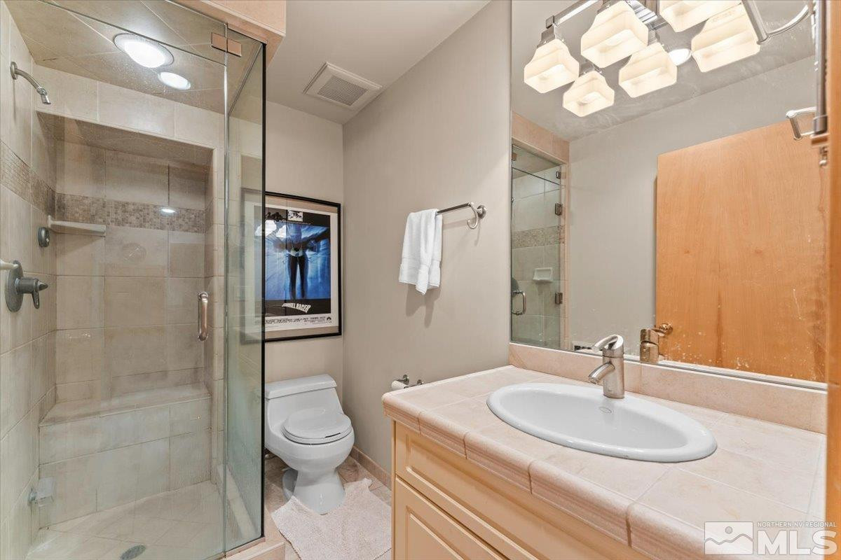 449 Fairview Boulevard Incline Village, NV 89451 - Photo 27 of 40 a bathroom with a sink toilet and shower