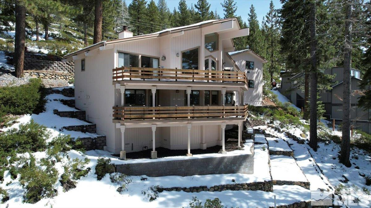 449 Fairview Boulevard Incline Village, NV 89451 - Photo 3 of 40 a view of a house with a yard