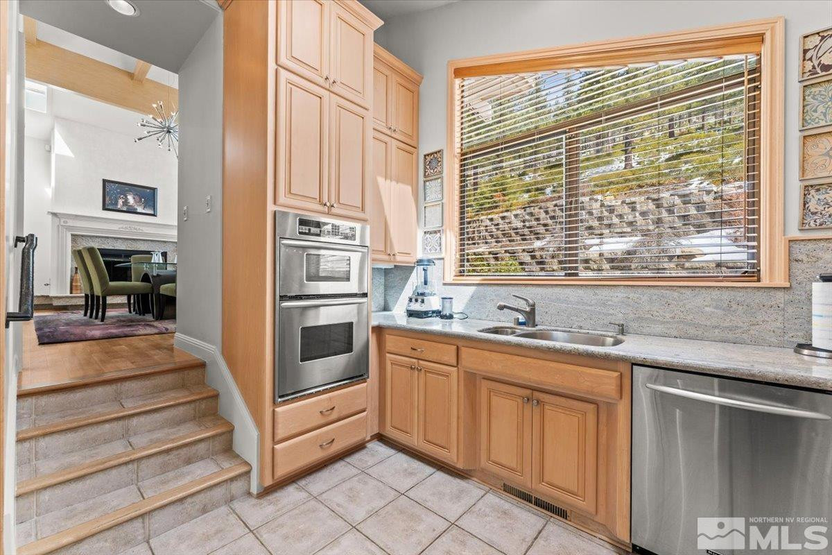 449 Fairview Boulevard Incline Village, NV 89451 - Photo 34 of 40 a kitchen with stainless steel appliances granite countertop a stove and more cabinets