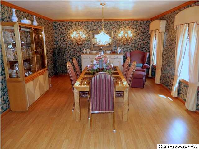 9 Rizzo Court Howell, NJ 07731 - Photo 8 of 23 a view of a dining room with furniture window and wooden floor