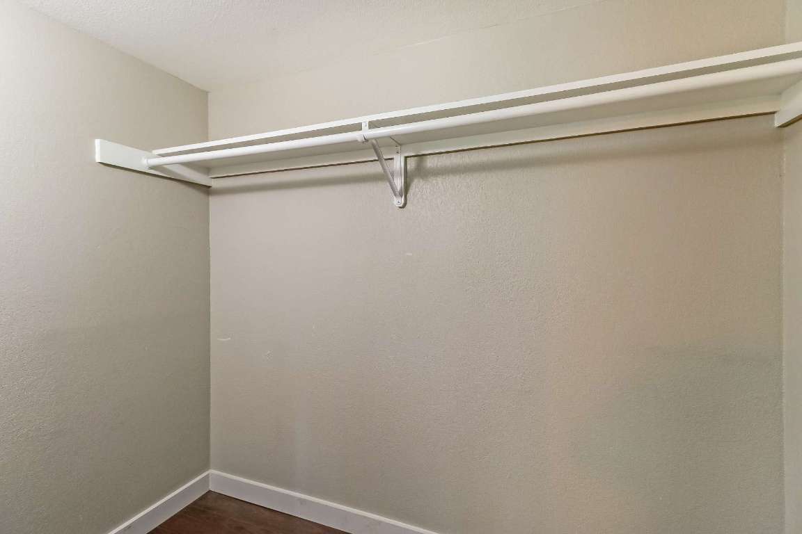 7202 Twin Crest Drive, Unit 103 Austin, TX 78752 - Photo 12 of 14 a view of a room with racks on the wall