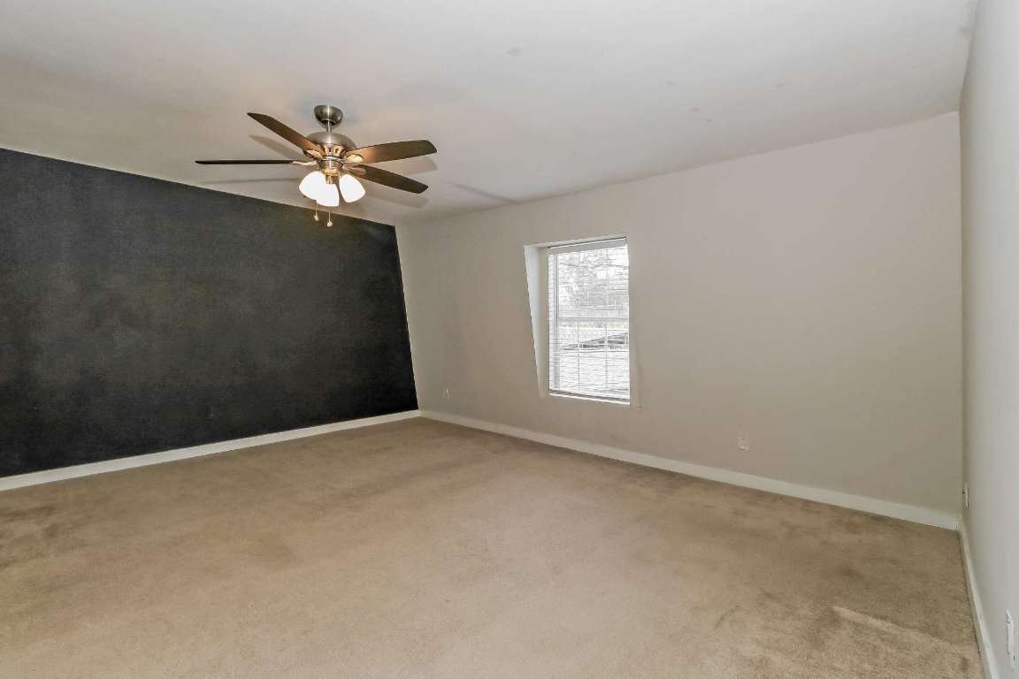 7202 Twin Crest Drive, Unit 103 Austin, TX 78752 - Photo 7 of 14 a view of an empty room with a window