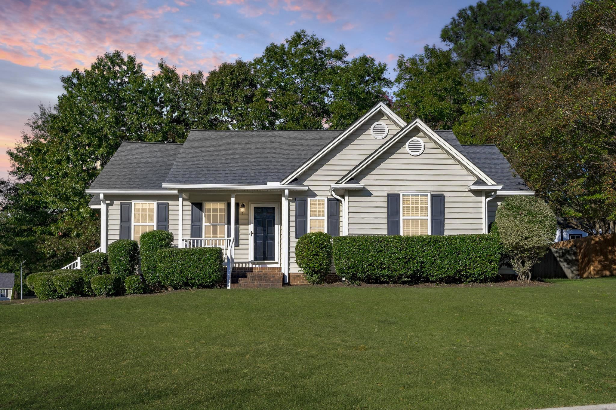 200 Peakhill Road Holly Springs, NC 27540 - Photo 1 of 18 a front view of a house with a yard and trees