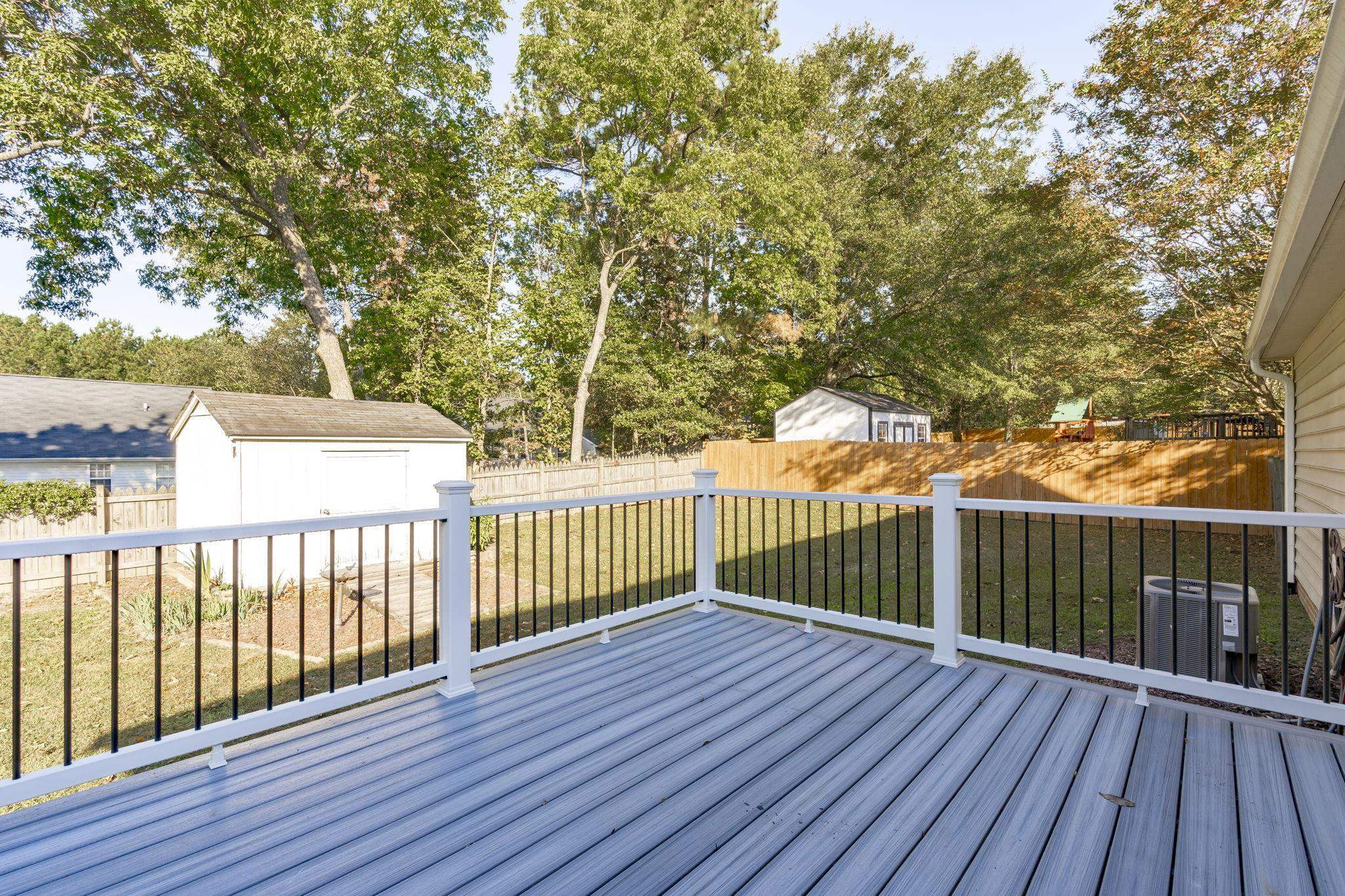 200 Peakhill Road Holly Springs, NC 27540 - Photo 13 of 18 a view of deck with wooden floor and fence