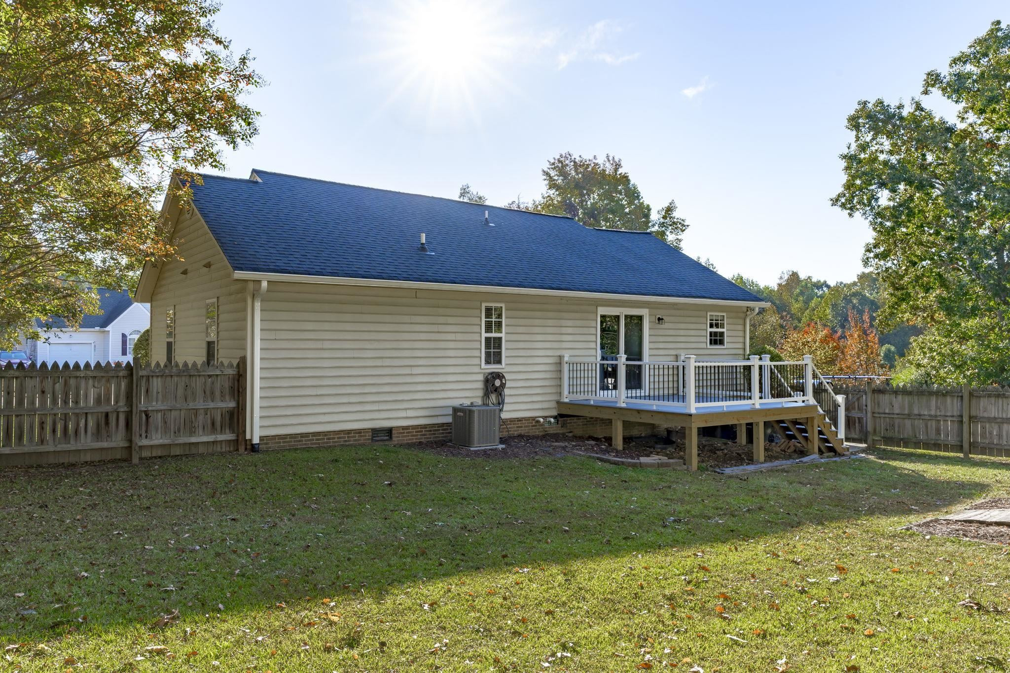 200 Peakhill Road Holly Springs, NC 27540 - Photo 14 of 18 a front view of a house with a yard