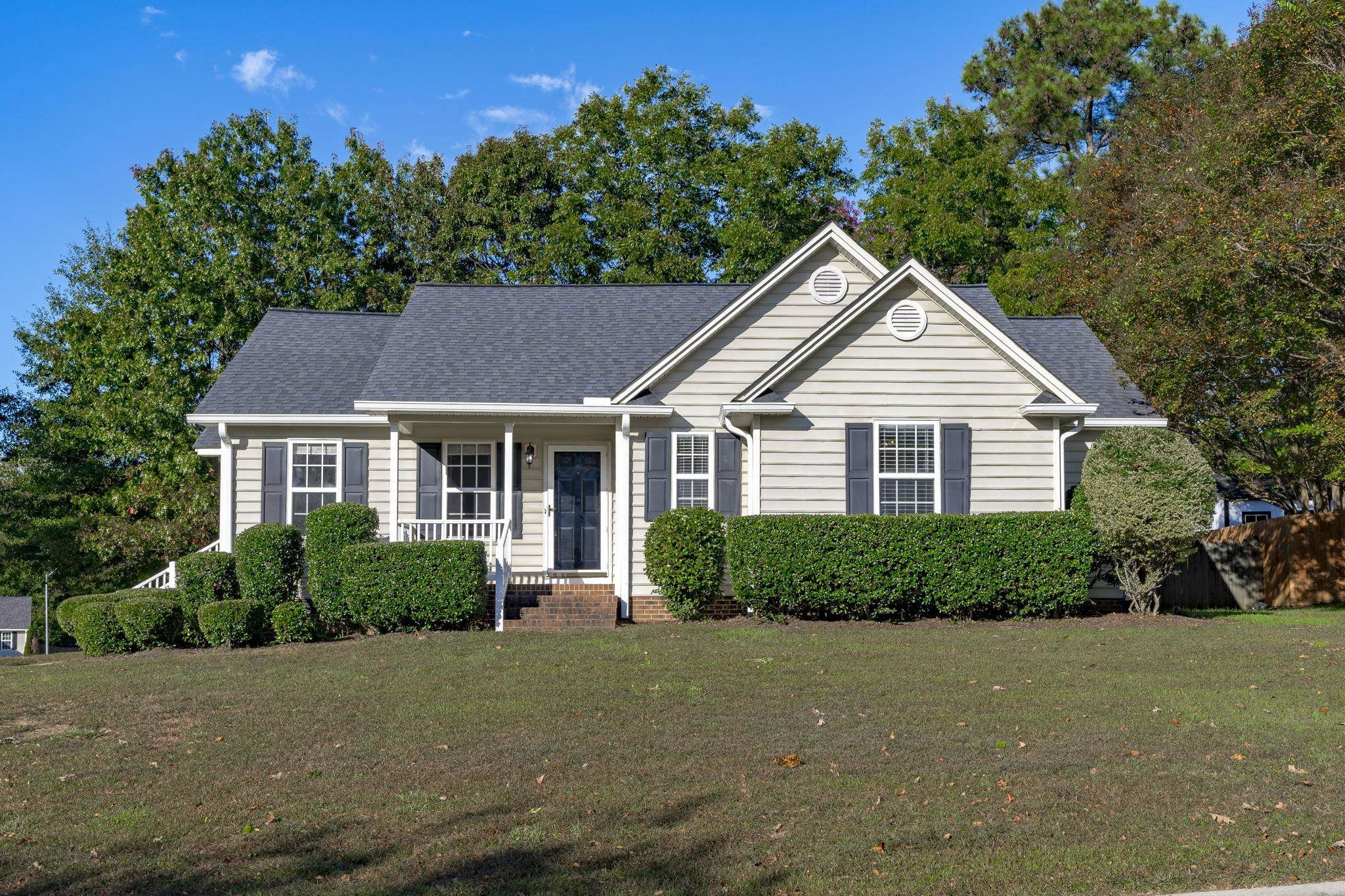 200 Peakhill Road Holly Springs, NC 27540 - Photo 2 of 18 a front view of a house with a yard and trees