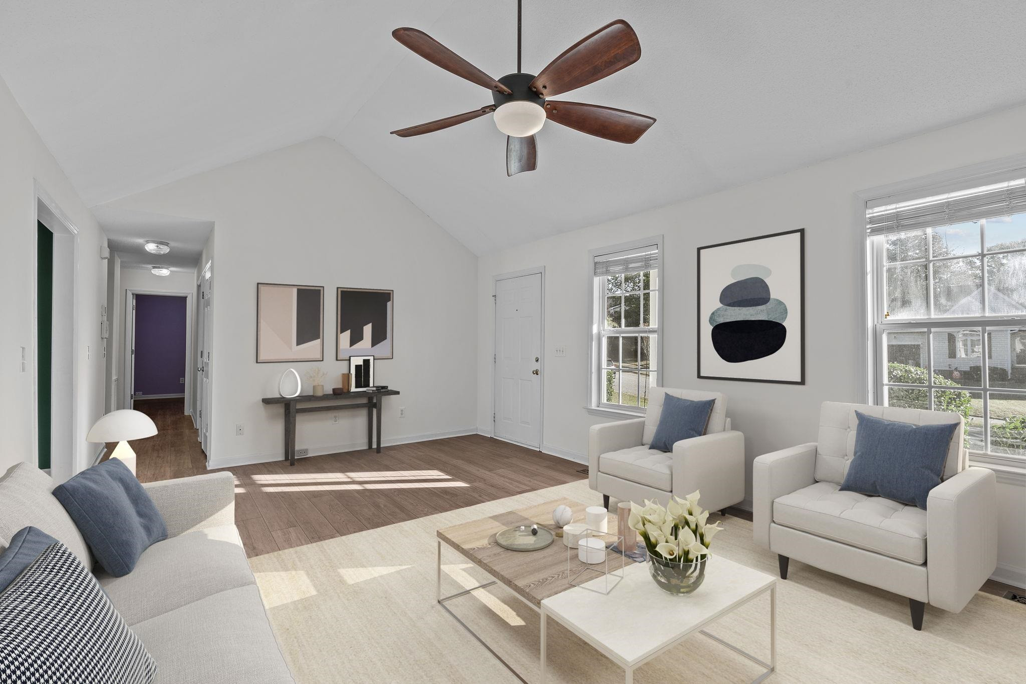 200 Peakhill Road Holly Springs, NC 27540 - Photo 3 of 18 a living room with furniture ceiling fan and a window