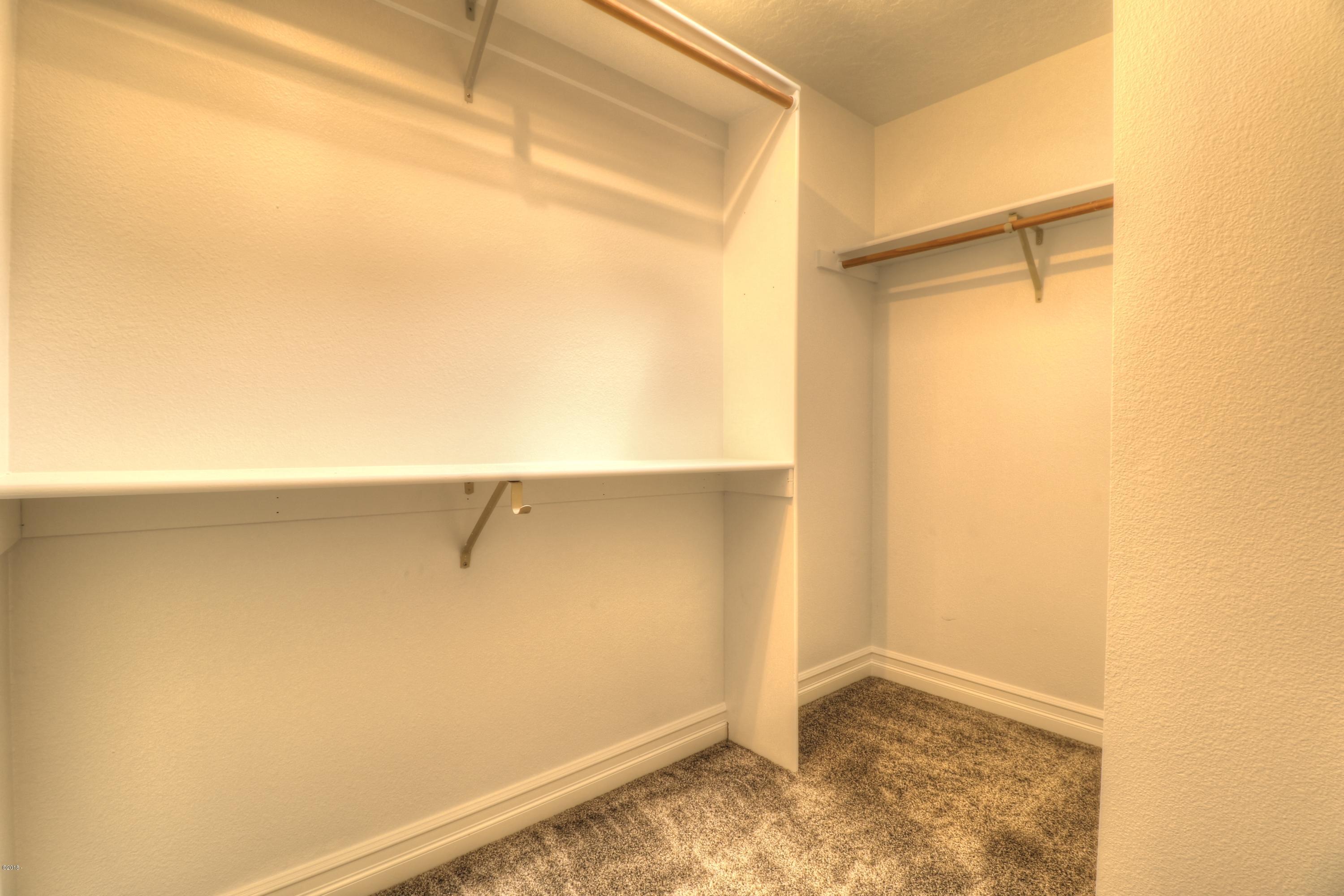 9775 Southeast Cedar Street South Beach, OR 97366 - Photo 29 of 33 Bedroom 3 Closet 1