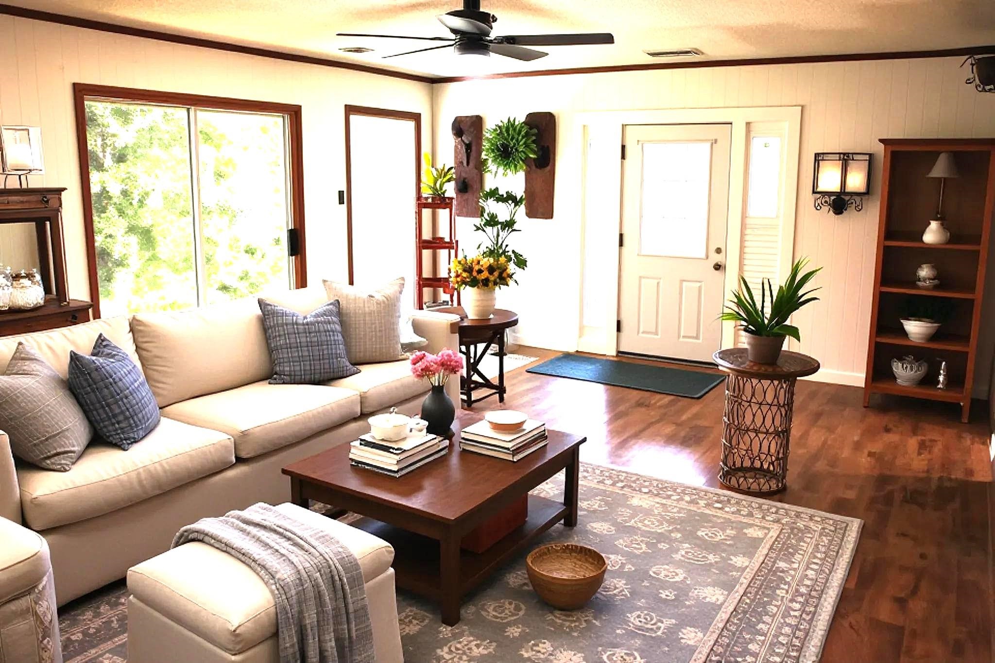 937 Kelleys Chapel Road Burlison, TN 38015 - Photo 8 of 40 Living area featuring wood-finish flooring, a ceiling fan with integrated lighting, and multiple windows. AI generated