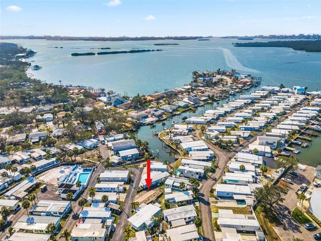 an aerial view of a city with lake view