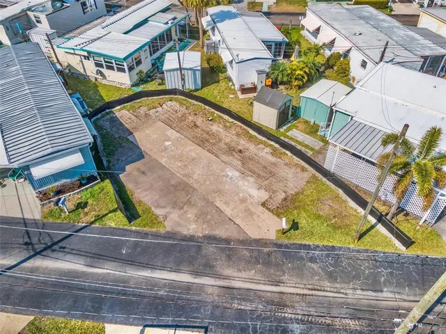 an aerial view of a house with a swimming pool