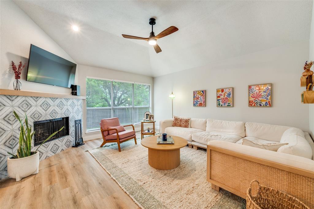 7306 Vista Ridge Lane Sachse, TX 75048 - Photo 9 of 23 a living room with furniture and a fireplace