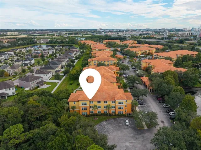 an aerial view of a house with a ocean view