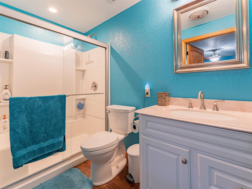 1857 Old Bonita Road Nocona, TX 76255 - Photo 15 of 39 a bathroom with a sink a toilet and shower