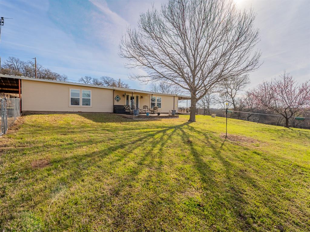 1857 Old Bonita Road Nocona, TX 76255 - Photo 18 of 39 a view of swimming pool with an outdoor space and seating area
