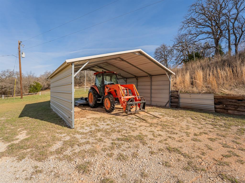 1857 Old Bonita Road Nocona, TX 76255 - Photo 27 of 39 a view of a wooden house with a snow in the background