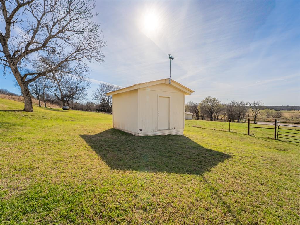 1857 Old Bonita Road Nocona, TX 76255 - Photo 28 of 39 a bathroom with a sink and view of lake