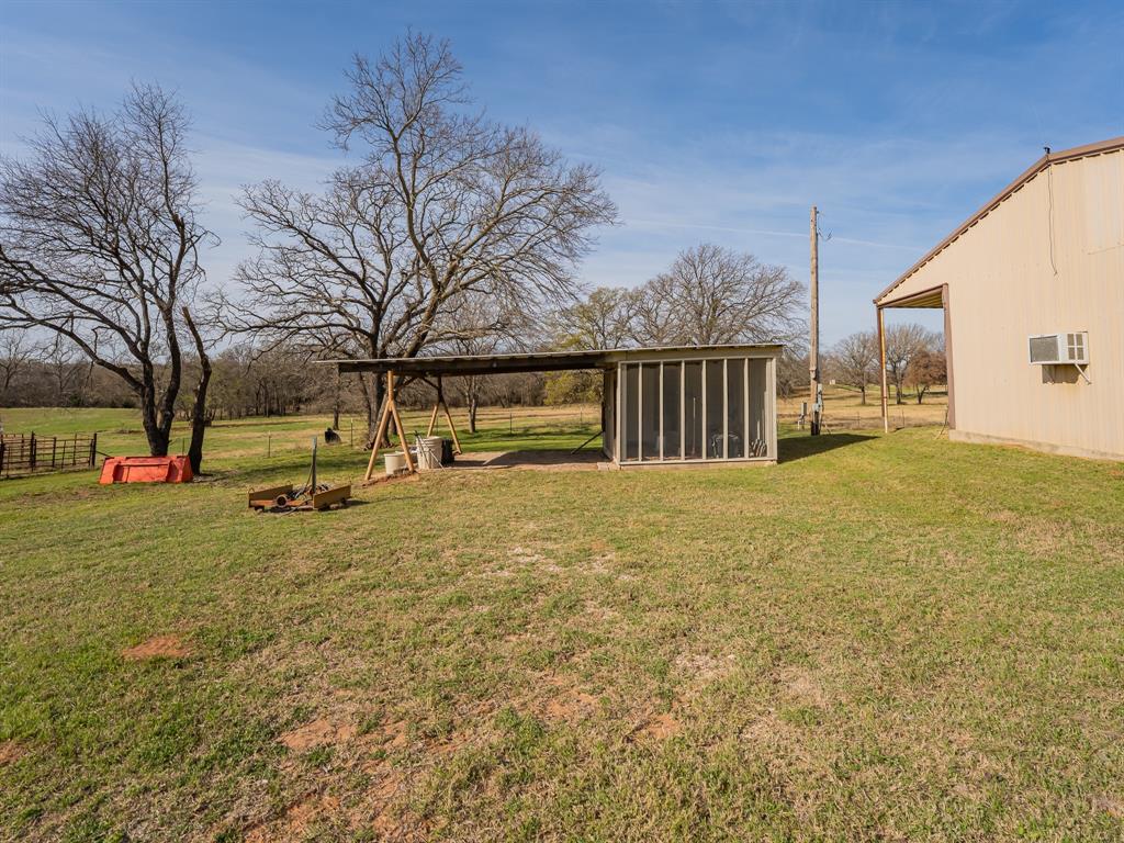 1857 Old Bonita Road Nocona, TX 76255 - Photo 29 of 39 a view of yard with swimming pool and trees