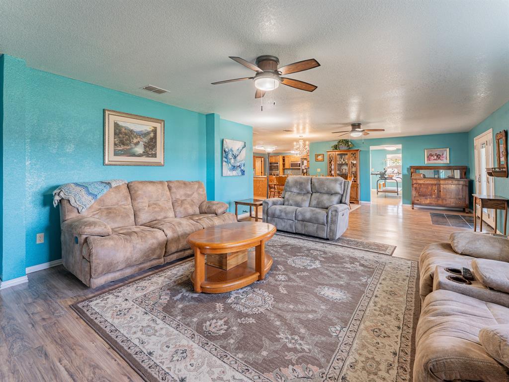 1857 Old Bonita Road Nocona, TX 76255 - Photo 5 of 39 a living room with furniture and a view of kitchen
