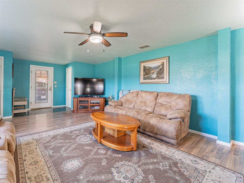 1857 Old Bonita Road Nocona, TX 76255 - Photo 6 of 39 a living room with furniture and a flat screen tv