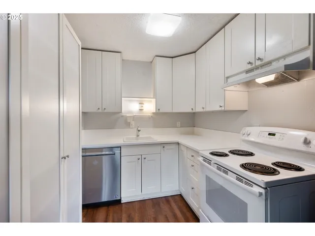 a kitchen with a refrigerator sink and stove