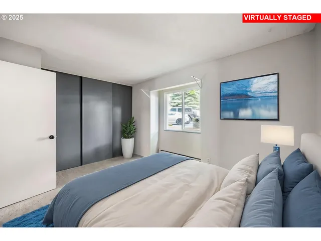 an empty room with windows and closet