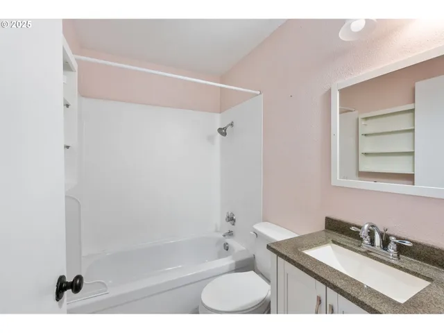 a room with furniture pool table and windows