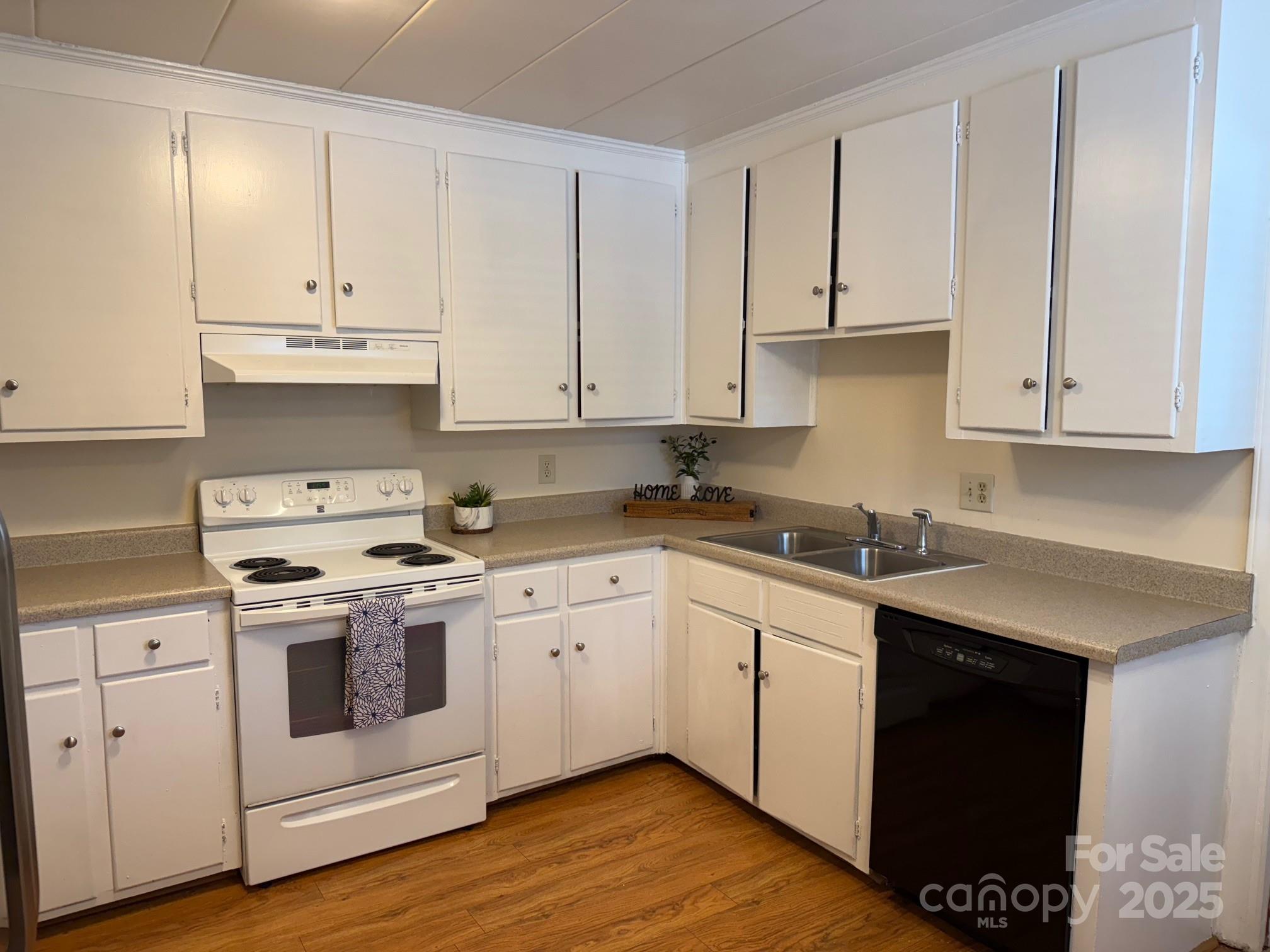 3010 Crosby Road, Unit 122 Charlotte, NC 28211 - Photo 11 of 38 a kitchen with granite countertop white cabinets and white appliances