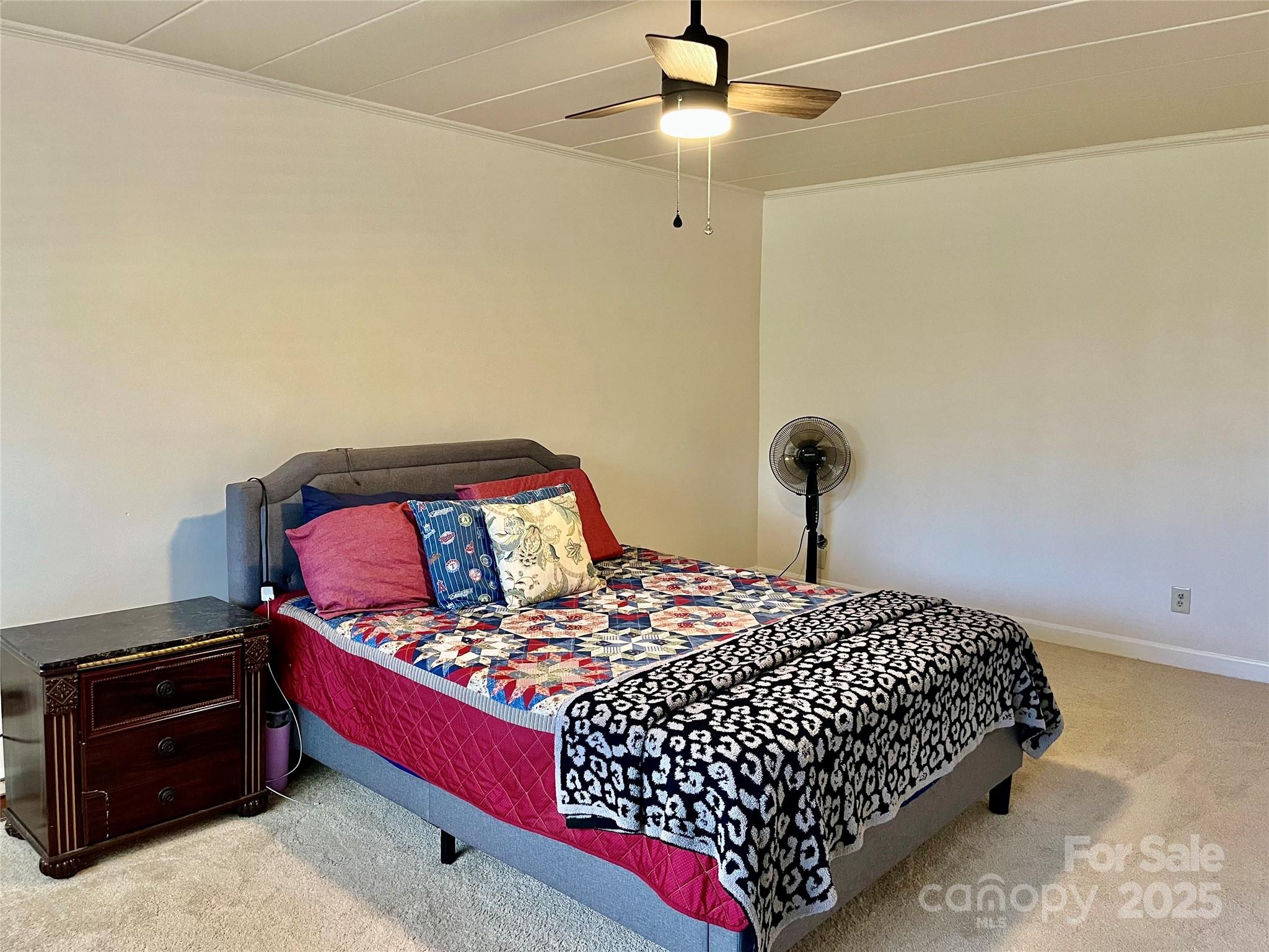 3010 Crosby Road, Unit 122 Charlotte, NC 28211 - Photo 13 of 38 a bedroom with a bed and a chandelier