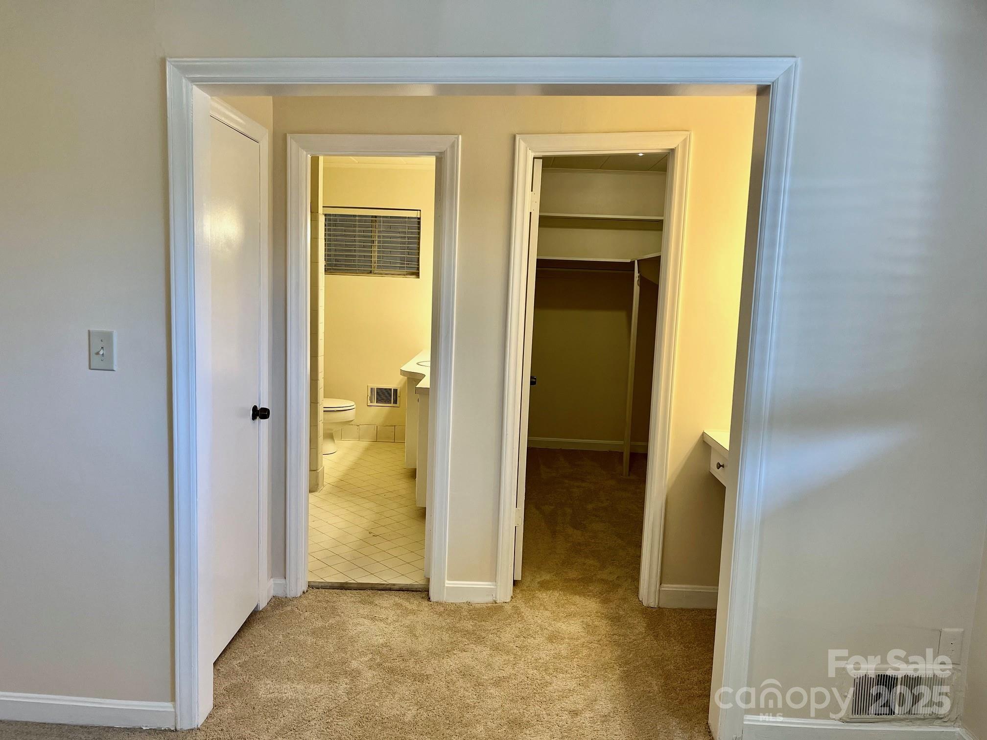 3010 Crosby Road, Unit 122 Charlotte, NC 28211 - Photo 15 of 38 a view of a bathroom with a glass door and a bathroom