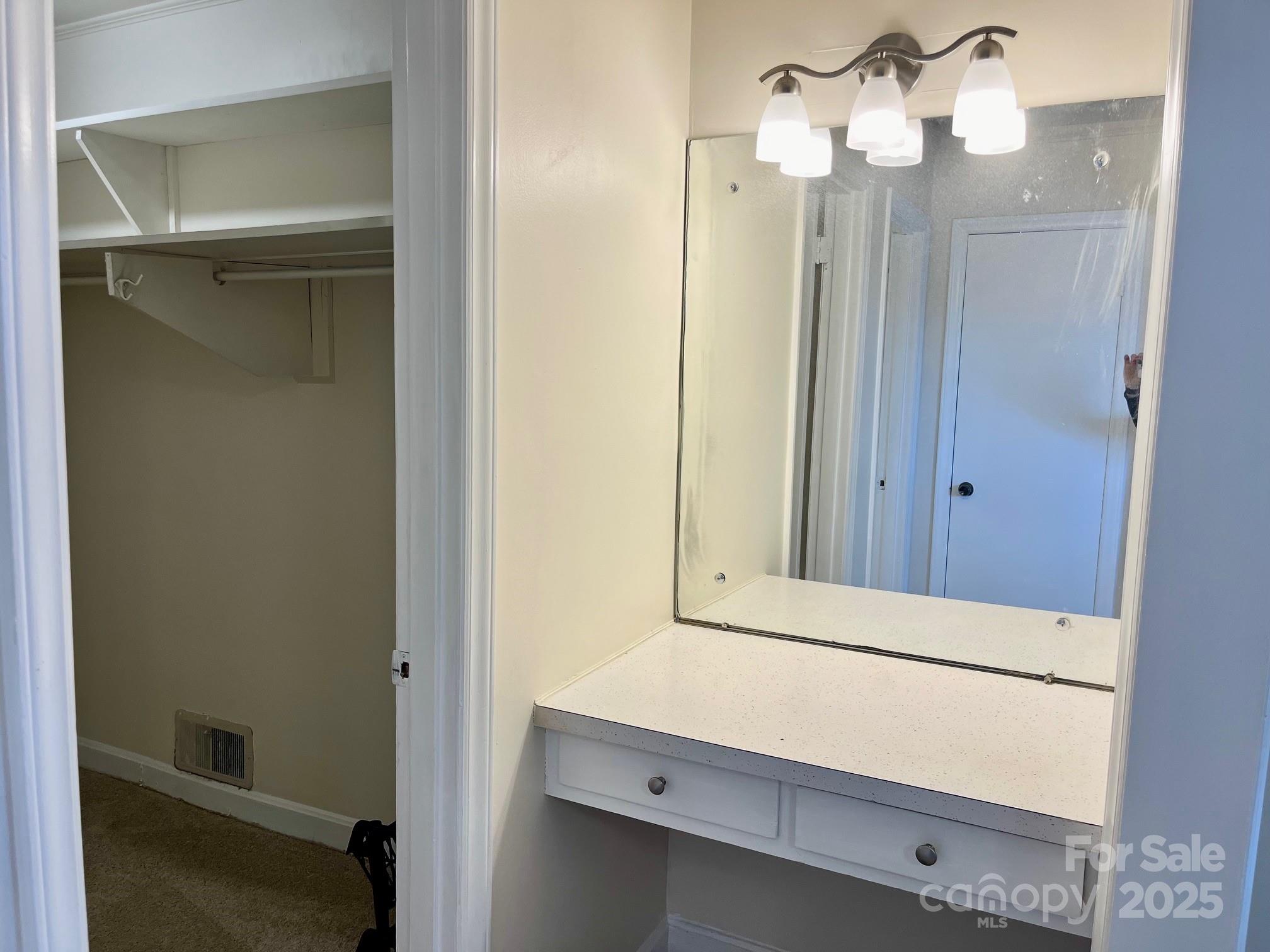 3010 Crosby Road, Unit 122 Charlotte, NC 28211 - Photo 18 of 38 a bathroom with a mirror and a shower