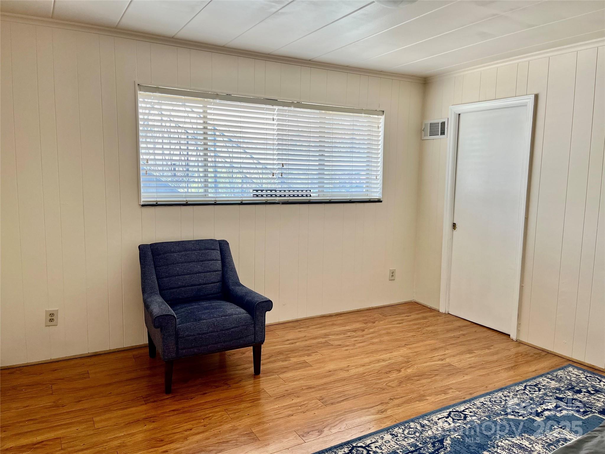 3010 Crosby Road, Unit 122 Charlotte, NC 28211 - Photo 20 of 38 a view of a bedroom with wooden floor and a window