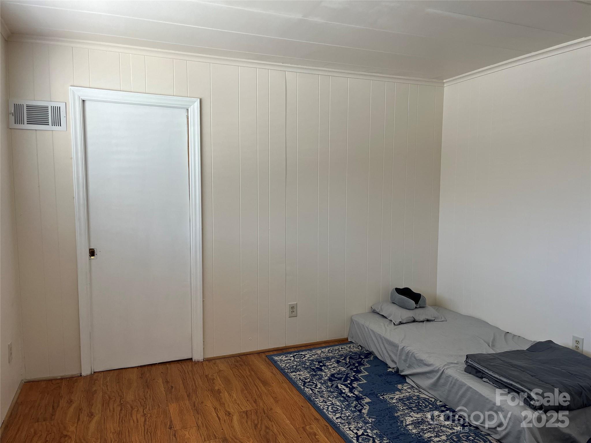 3010 Crosby Road, Unit 122 Charlotte, NC 28211 - Photo 22 of 38 a room with a rug and a wooden floor