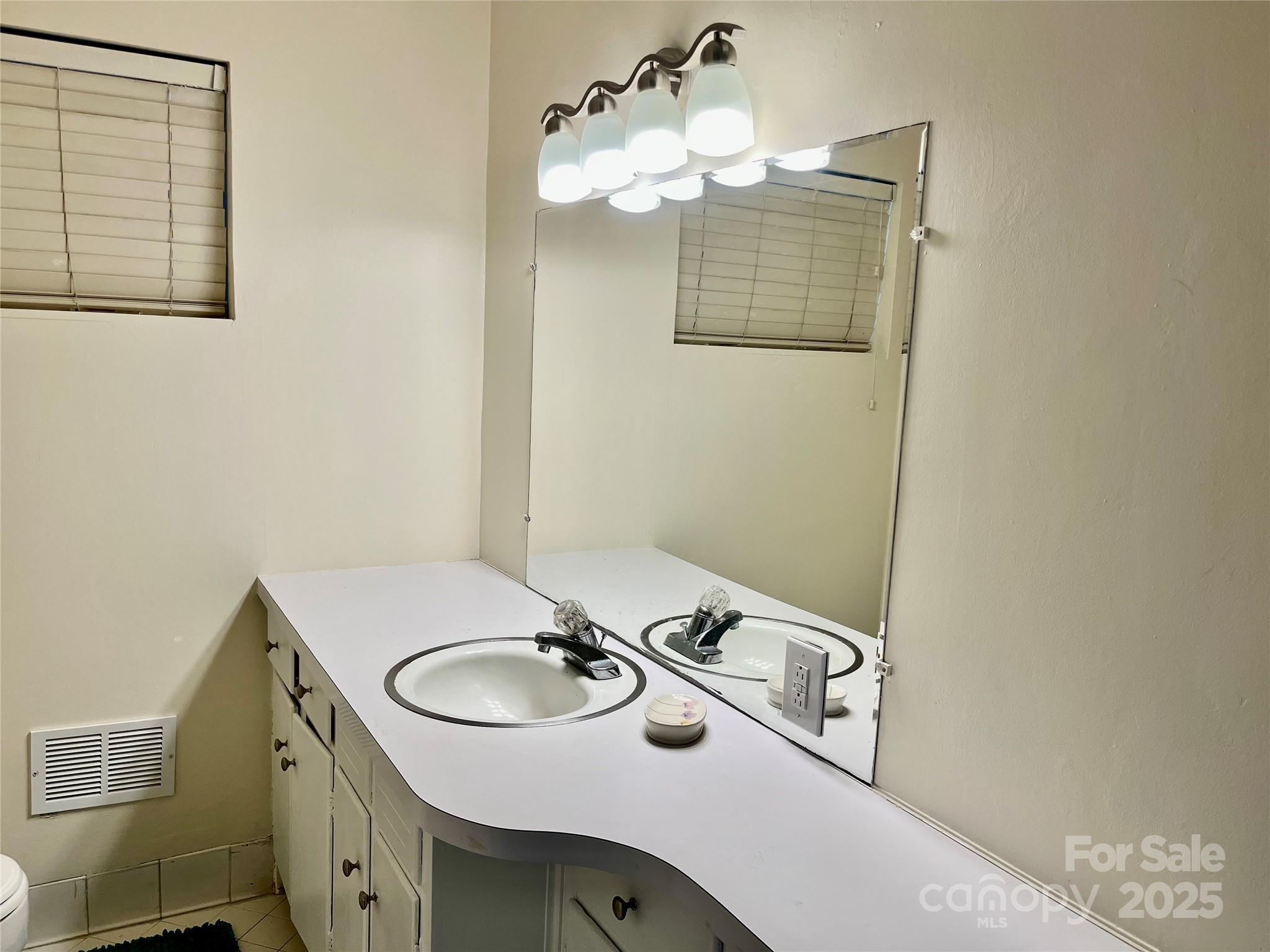 3010 Crosby Road, Unit 122 Charlotte, NC 28211 - Photo 30 of 38 a bathroom with a sink and a mirror
