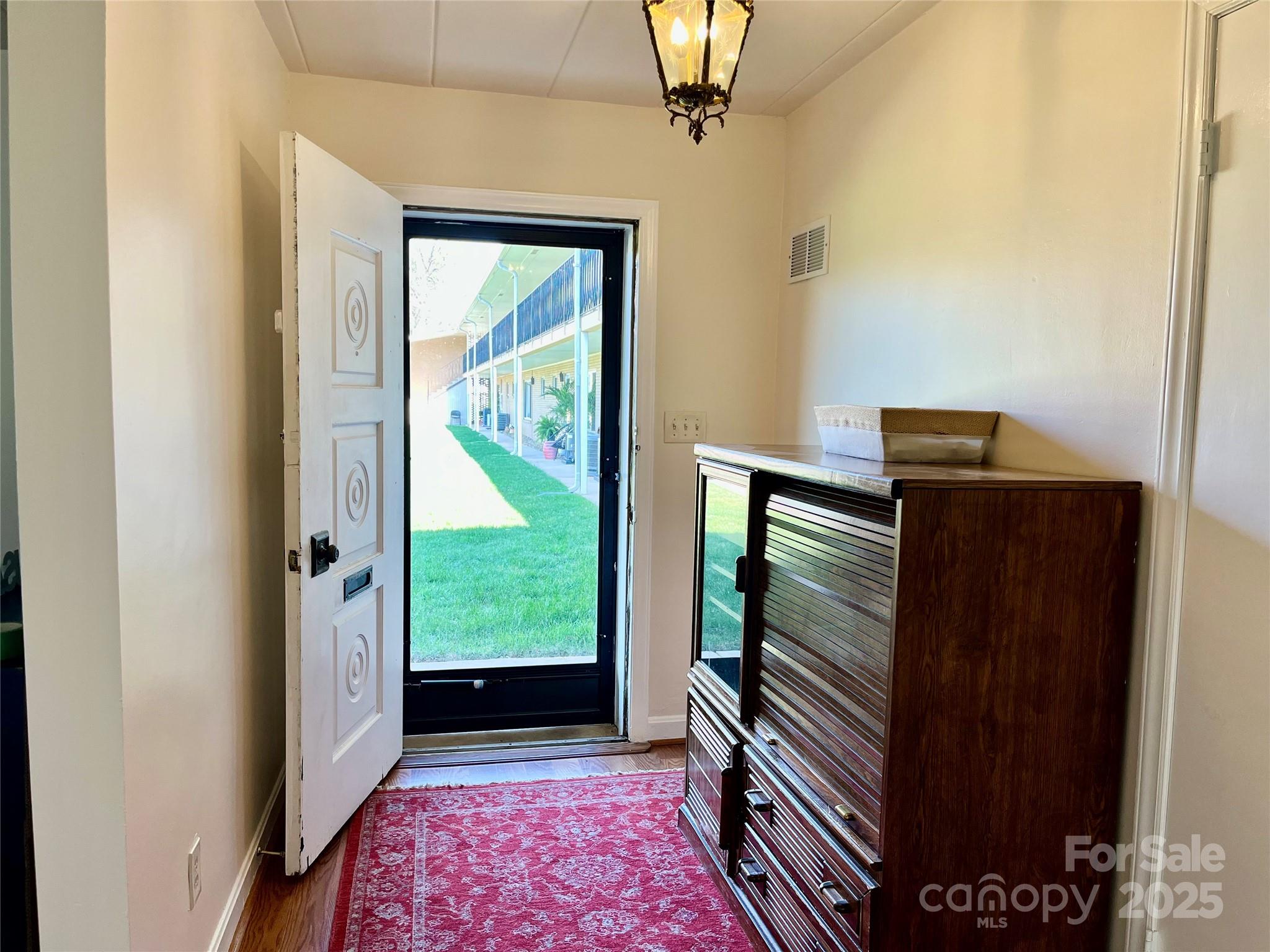 3010 Crosby Road, Unit 122 Charlotte, NC 28211 - Photo 3 of 38 a view of hallway with a large window and outer view