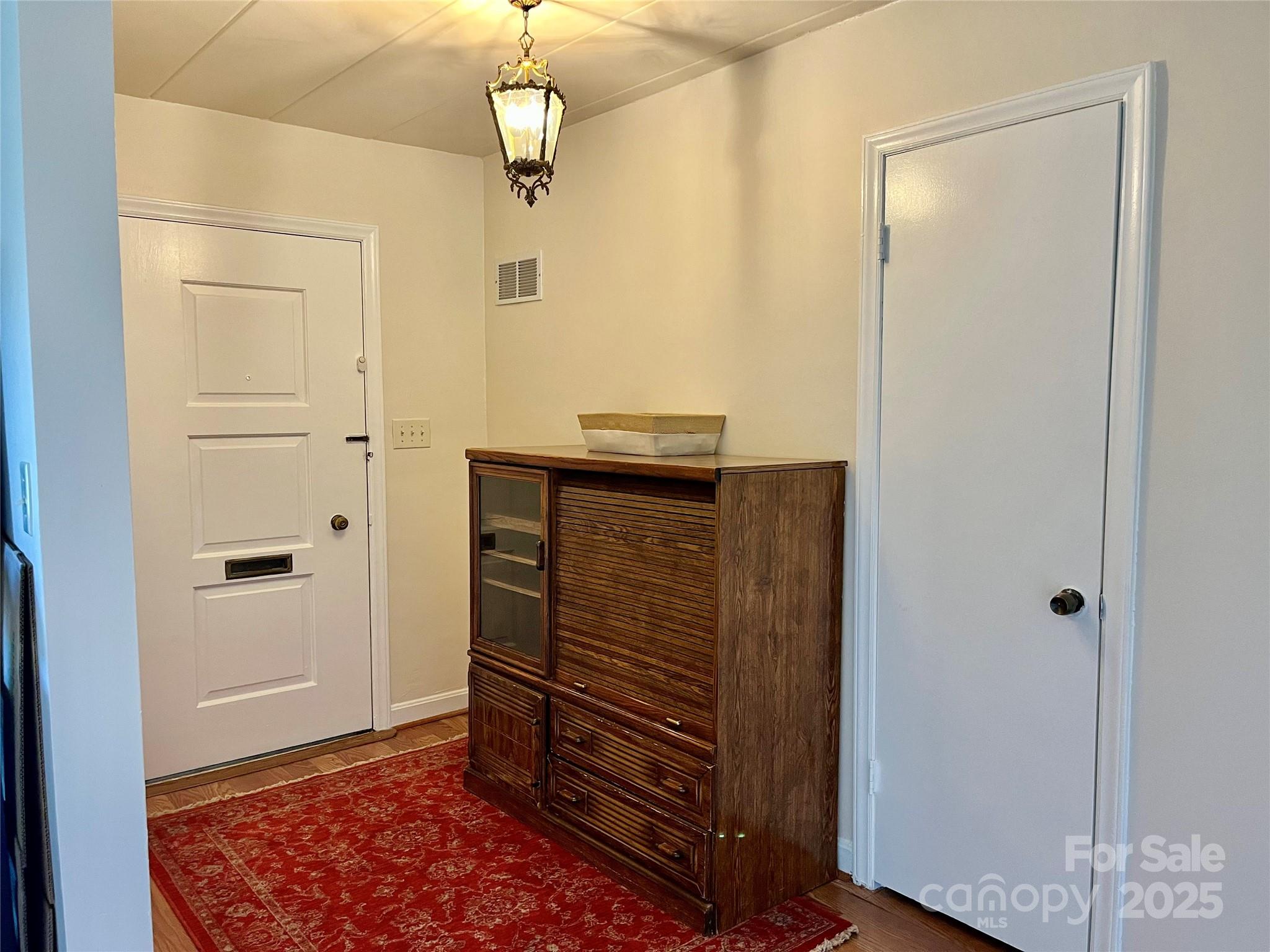 3010 Crosby Road, Unit 122 Charlotte, NC 28211 - Photo 4 of 38 a view of entryway with wooden floor