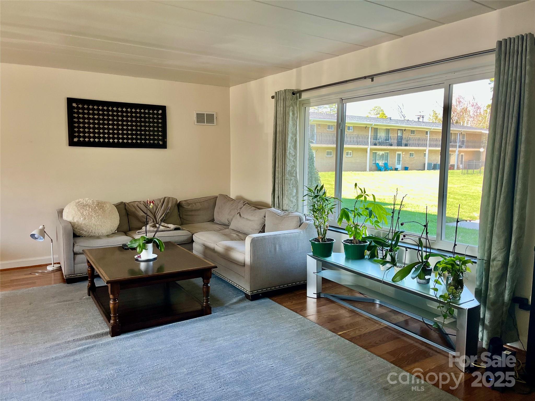 3010 Crosby Road, Unit 122 Charlotte, NC 28211 - Photo 7 of 38 a living room with furniture and a potted plant
